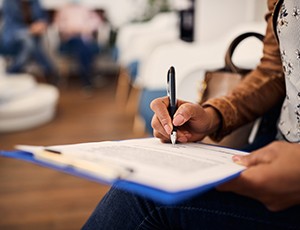 Patient filling out form in lobby