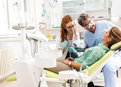 dentist and assistant working on a patient