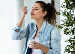 Woman eating yogurt